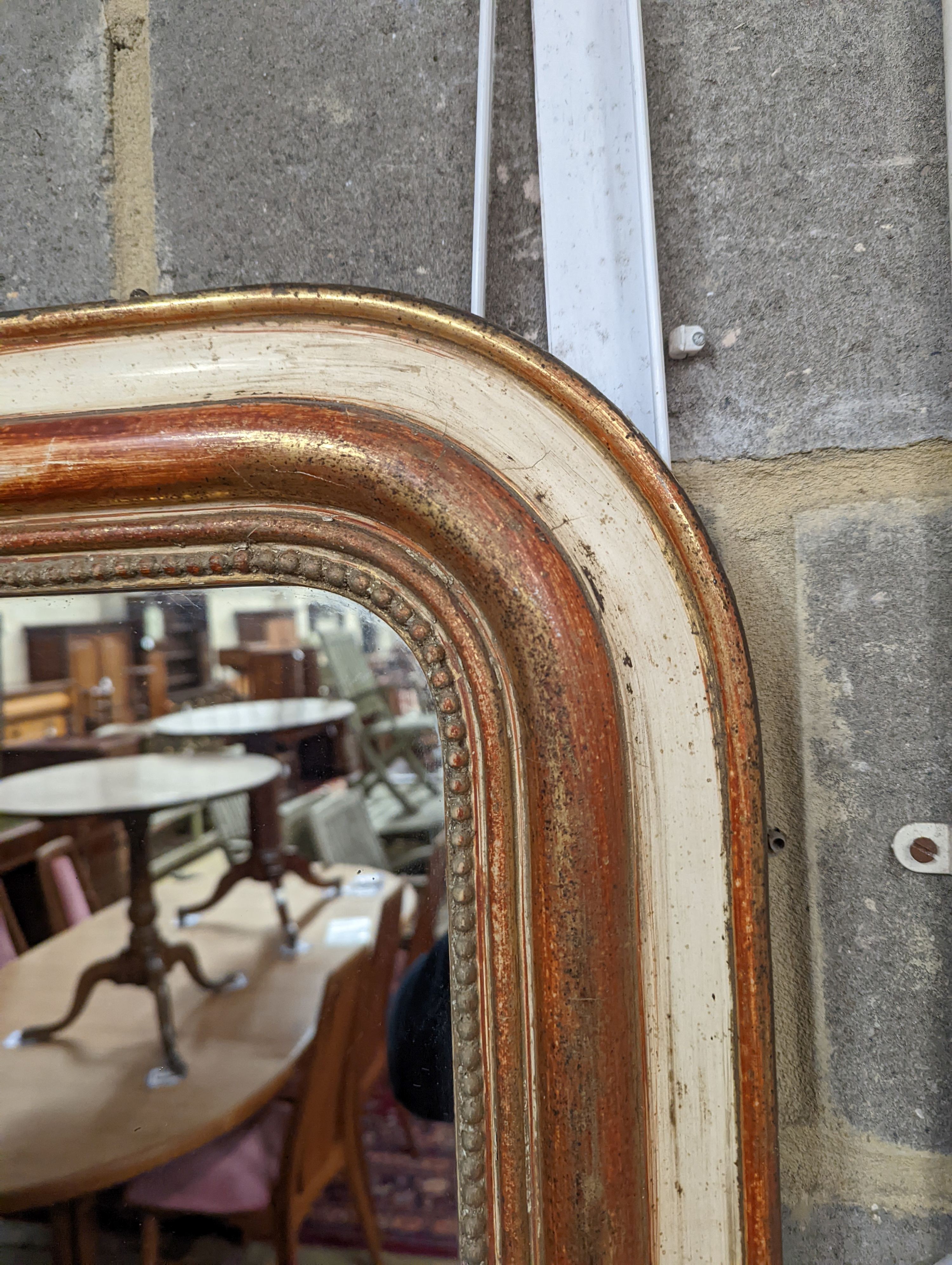 A 19th century French parcel gilt overmantel mirror, width 75cm, height 99cm